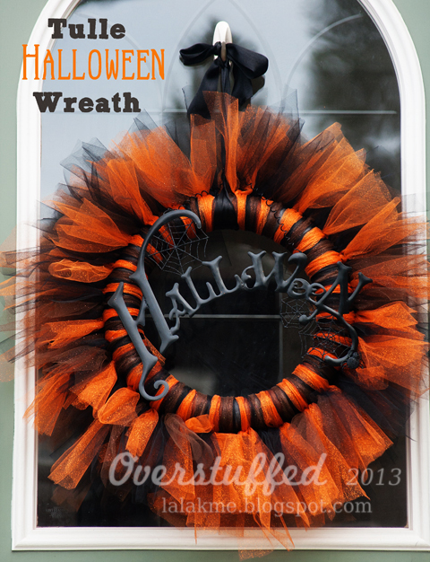 How to make a beautiful orange and black Halloween wreath out of tulle. This Halloween wreath is simple and inexpensive to make. #overstuffedlife