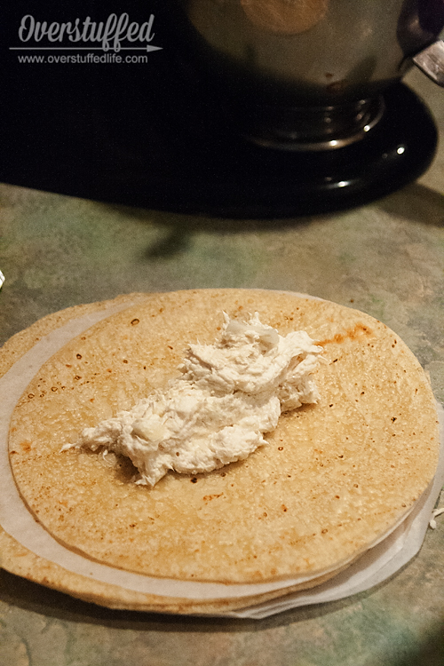 Making gluten free chicken enchiladas with brown rice tortillas