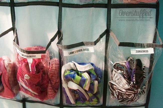 Great idea for American Girl Doll clothes! Organize the outfits with an over the door shoe organizer!