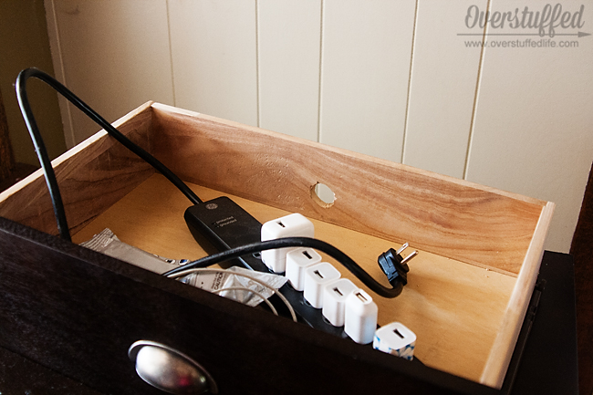 Drill the hole into the drawer large enough for plugs to go through.