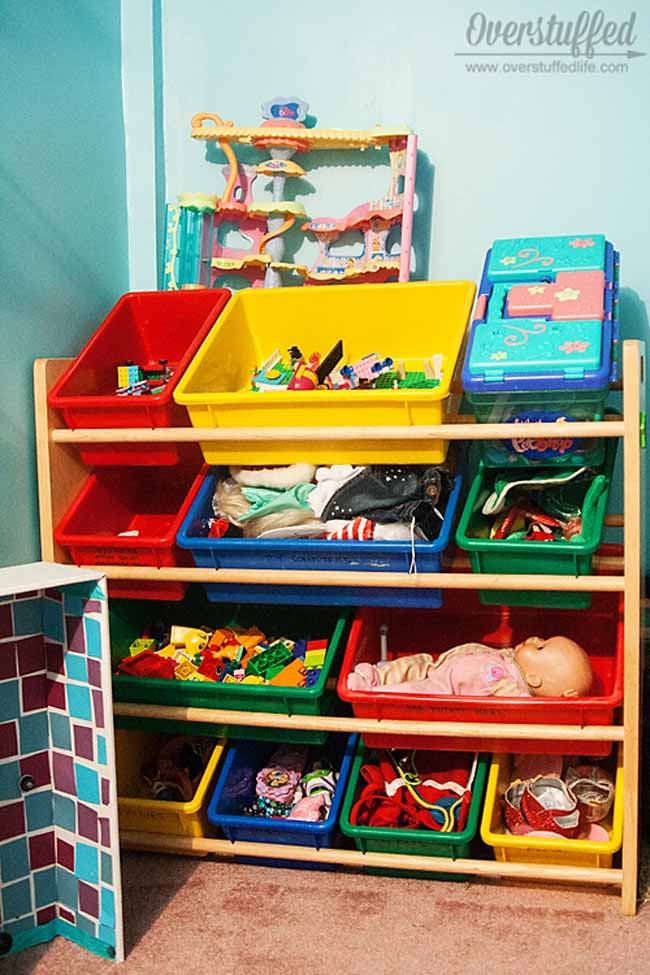 The process of organizing toys can be a painful one. Some ideas to cut down your toy population and get those toys organized!