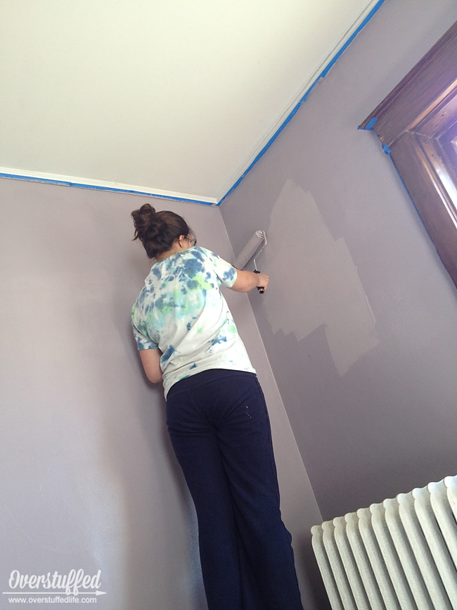 My teenager painting my bedroom in Sherwin Williams Beguiling Mauve.