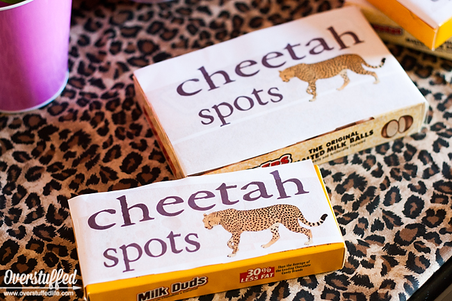 Use candies like whoppers, rolos, or milk duds to be "cheetah spots" for cheetah themed party favors. Free printable download. #overstuffedlife 