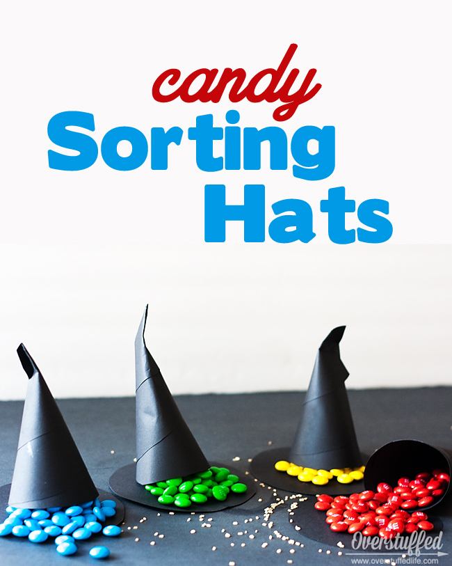 Make fun candy sorting hats for your Harry Potter party. When the cones are opened, the candy color tells them which house they are sorted into. #overstuffedlife