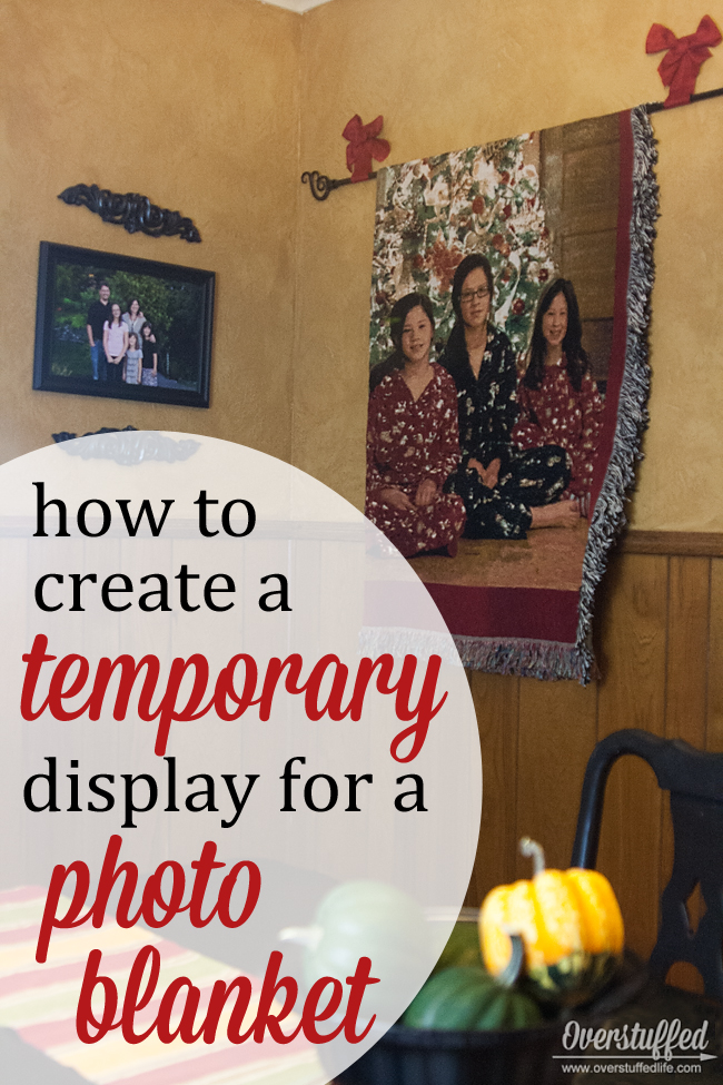 Have a decorative blanket or quilt you only want to display seasonally? Here's a super easy tutorial for a temporary wall display. #overstuffedlife
