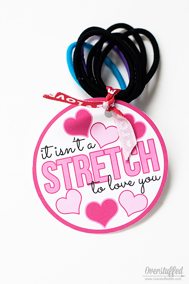 This cute Valentine's Day printable is meant for use with hair elastics. #overstuffedlife