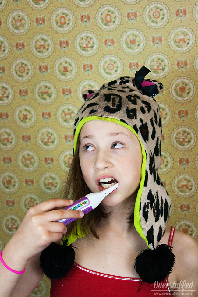 Do you tell your kids to brush their teeth 100 times a day? Stop the nagging and start doing this simple trick and watch those teeth get brushed happily! #overstuffedlife