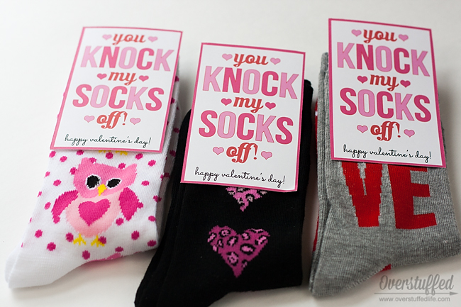 Give a pair of Valentine's Day themed socks and use this adorable Valentine's "you knock my socks off" printable. #overstuffedlife