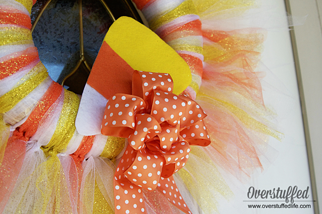 Finish off your Halloween tulle wreath with a felt candy corn decoration and an orange polka dotted bow