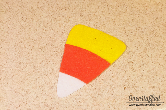 Add orange and yellow felt cut outs to the stiff white felt to make a cute candy corn decoration