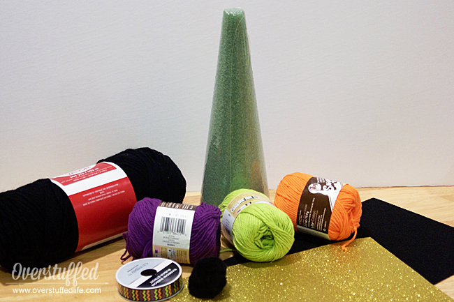 Supplies needed to make yarn witch hats.