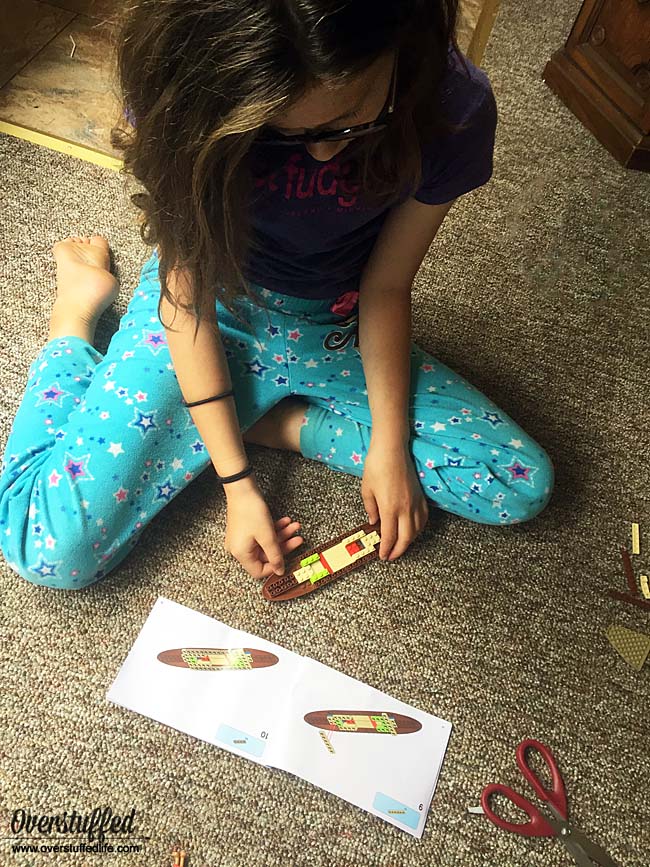 Sophia building the boat from her Moana LEGO set.