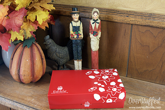 Red edible arrangements box containing chocolate covered fruit